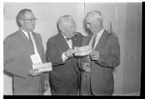Men with Johnson-Kennedy bumper stickers 